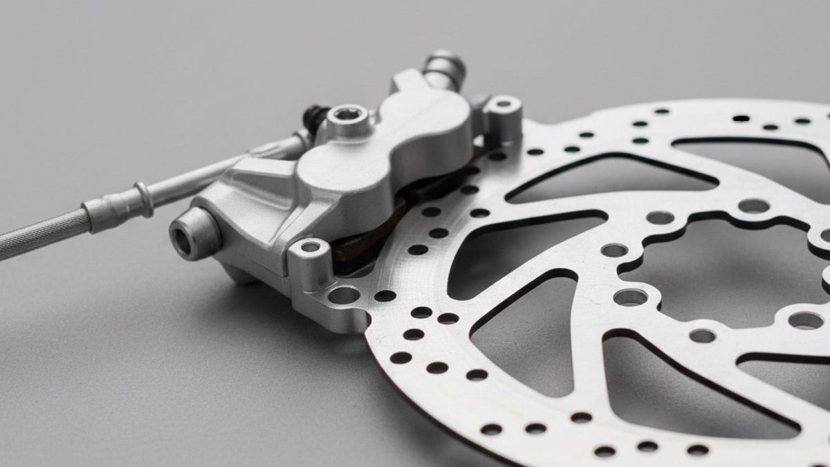 Close-up of a hydraulic disc brake rotor and caliper